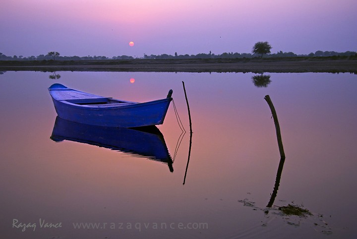 Lonely Boat At Sunset In The river Ravi